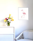 Flamingo Mom and Baby Art Print on White Background in White Frame Hanging in Modern Nursery